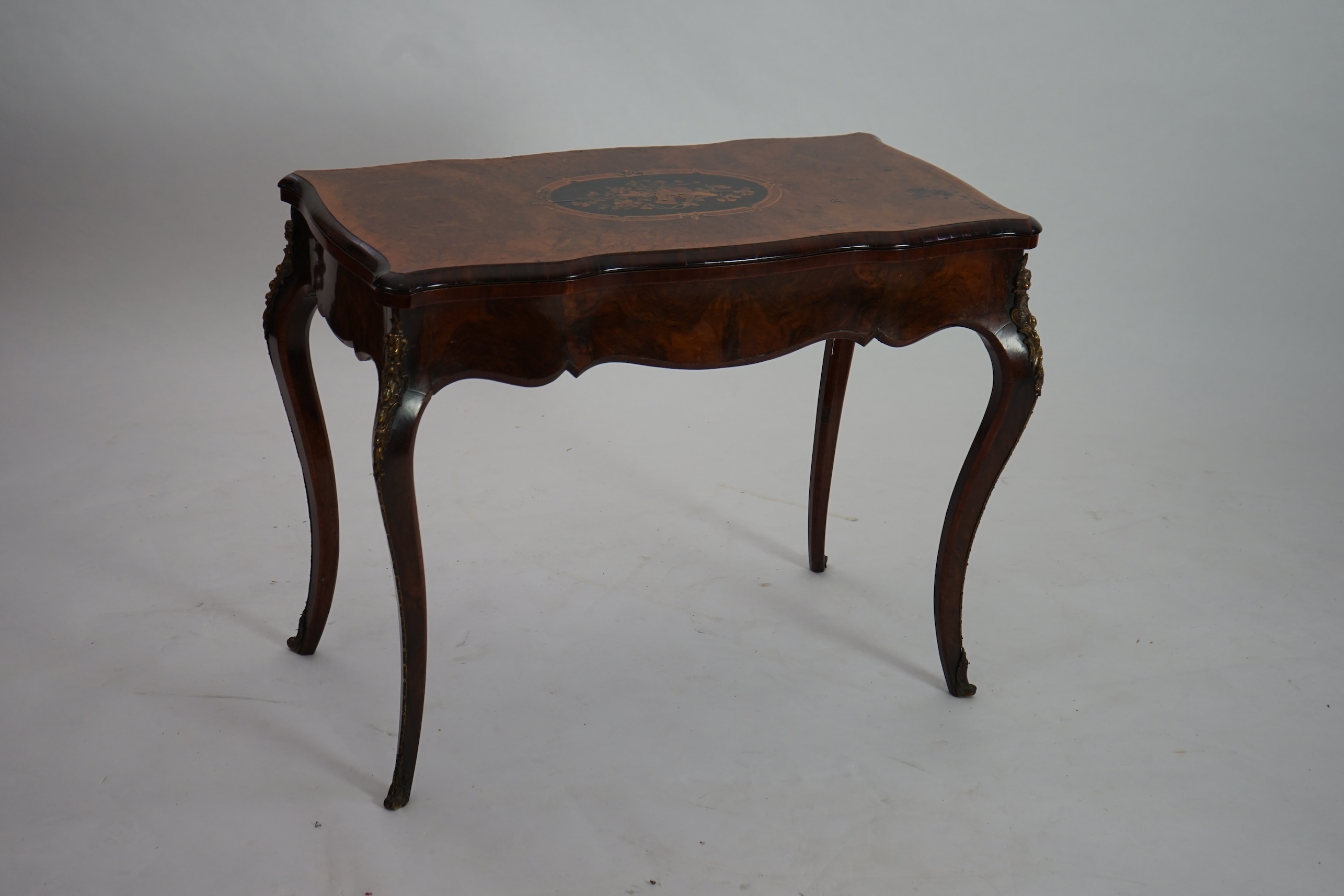 A Victorian marquetry inlaid burr walnut card table